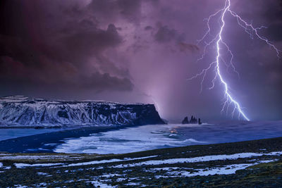 Scenic view of lightning against dramatic sky