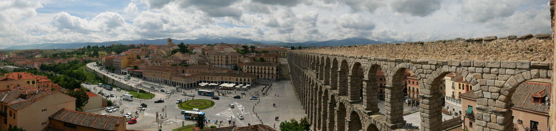 High angle view of old buildings in city against sky