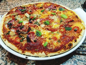 High angle view of pizza served on table