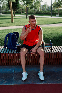 Young woman sitting on bench