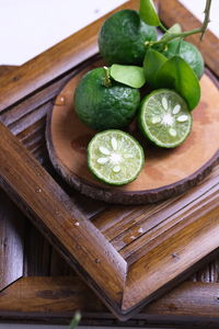 High angle view of fruits and vegetables on cutting board