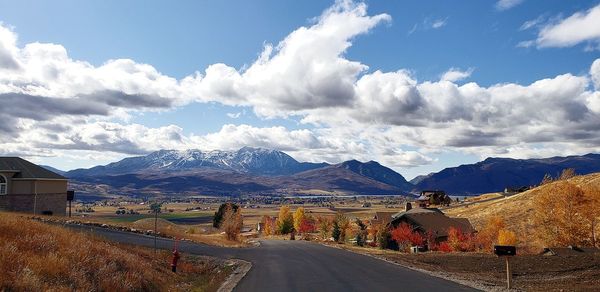 Panoramic view of road and mountains against sky