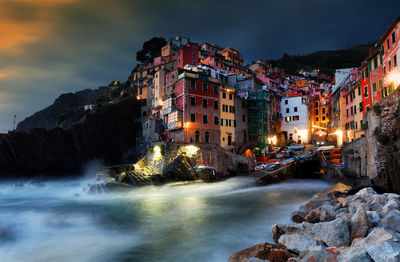 View of city in front of houses at dusk