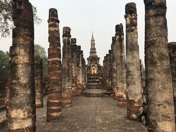 Historic temple against buildings