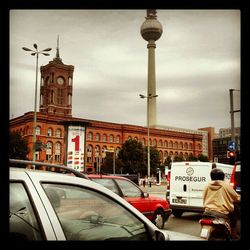 View of buildings against cloudy sky