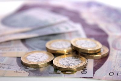 Close-up of coins and paper currency