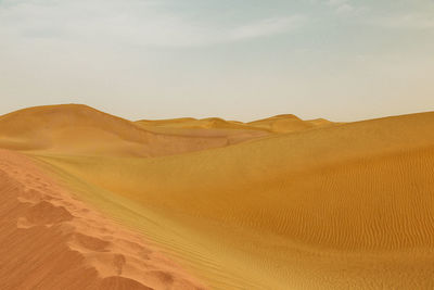 Scenic view of desert against sky