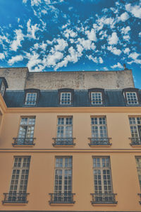 Low angle view of residential building against sky