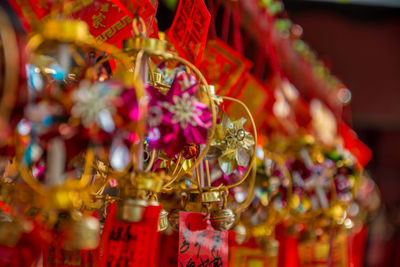 Close-up of religious equipment hanging outside temple