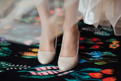 Low section of woman standing on floor