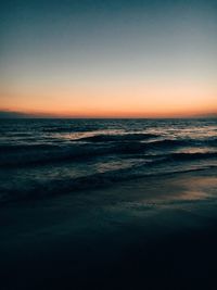 Scenic view of beach at sunset