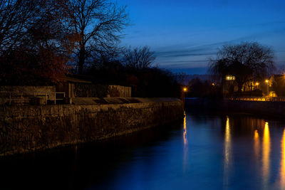 Scenic view of river against sky at night