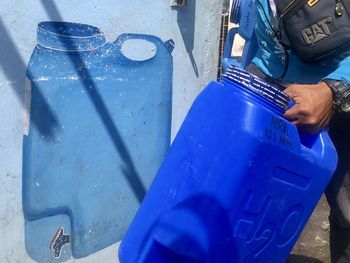 High angle view of man working on metal