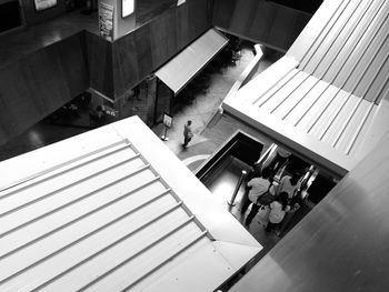 High angle view of people walking on staircase