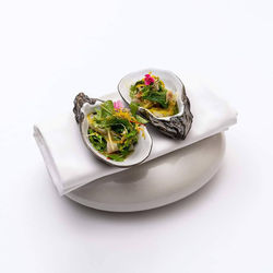 High angle view of food in plate on white background