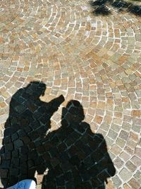 Shadow of woman on street