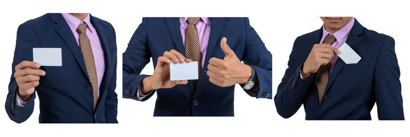 Panoramic view of man holding umbrella against white background