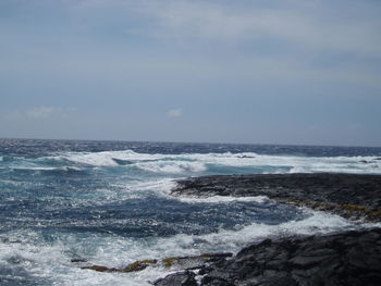 Scenic view of beach and sea against sky