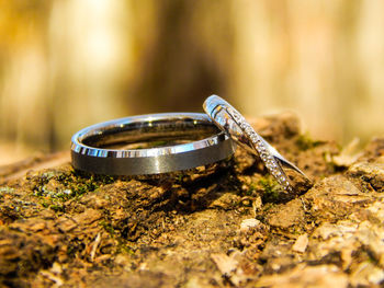 Close-up of wedding rings on field