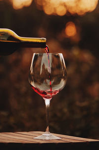 Close-up of wineglass on table