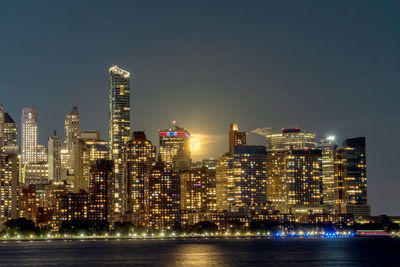 Illuminated buildings in city at night