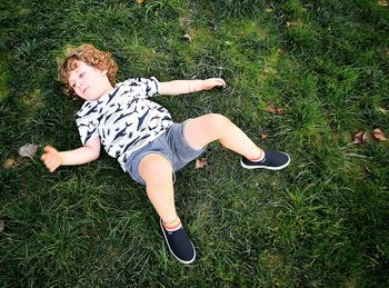 High angle view of man lying on field