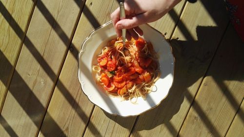 High angle view of woman holding food