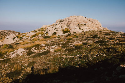 Scenic view of rocky mountains against clear sky