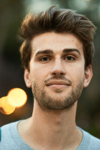 Close-up portrait of smiling young man