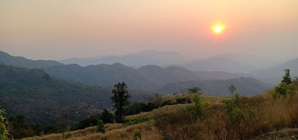 Scenic view of mountains against sky during sunset