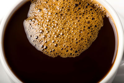 High angle view of coffee cup on table