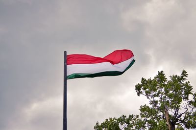 Low angle view of flag against sky