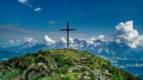 Scenic view of mountains against blue sky