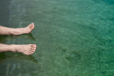 Low section of person in sea