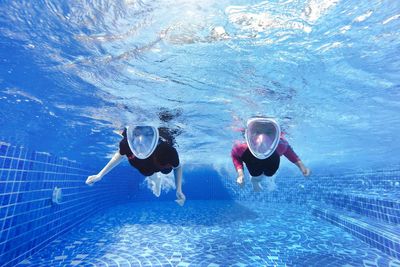 Young women swimming in pool