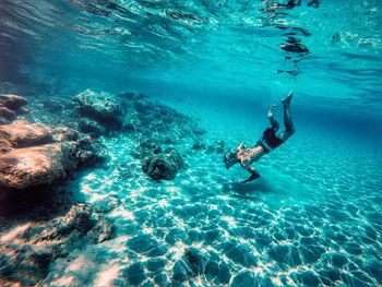 High angle view of man swimming in sea