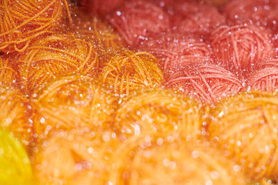 Close up of multicolored yarn balls in knitting shop center. colorful yarn wool for knitting