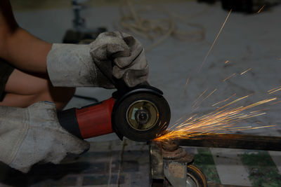 Midsection of person working with fire hydrant