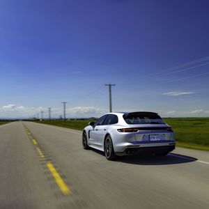 Car on road against blue sky