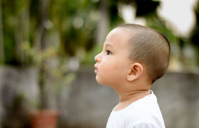 Close-up of boy looking away