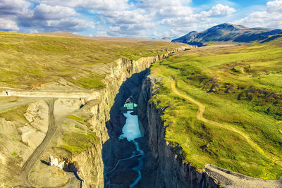 High angle view of river amidst landscape against sky