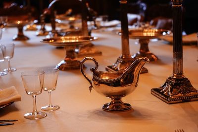 Close-up of wine glasses on table
