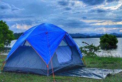 Tent on field against sky