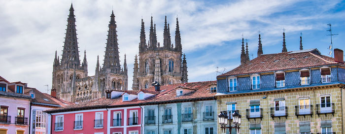 Low angle view of buildings in city against sky