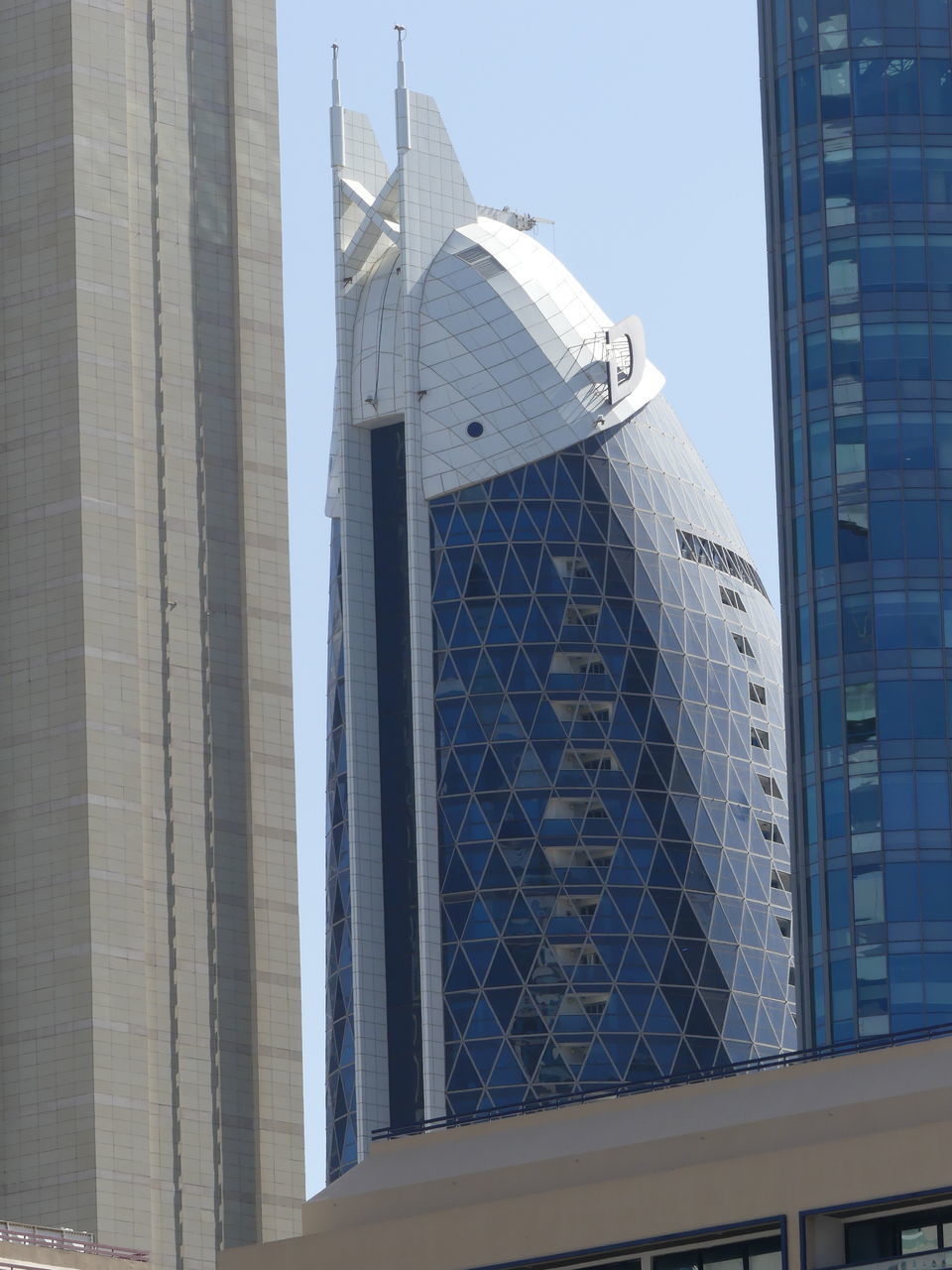 LOW ANGLE VIEW OF OFFICE BUILDING AGAINST SKY