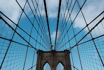 Low angle view of brooklyn bridge against sky