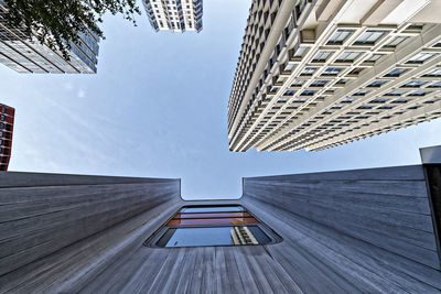 Low angle view of modern buildings against sky