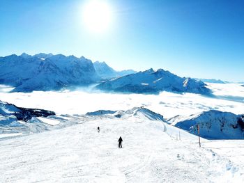 Scenic view of snowcapped mountains against clear sky