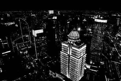 Aerial view of city lit up at night