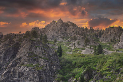 Scenic view of rocky mountains against sky during sunset